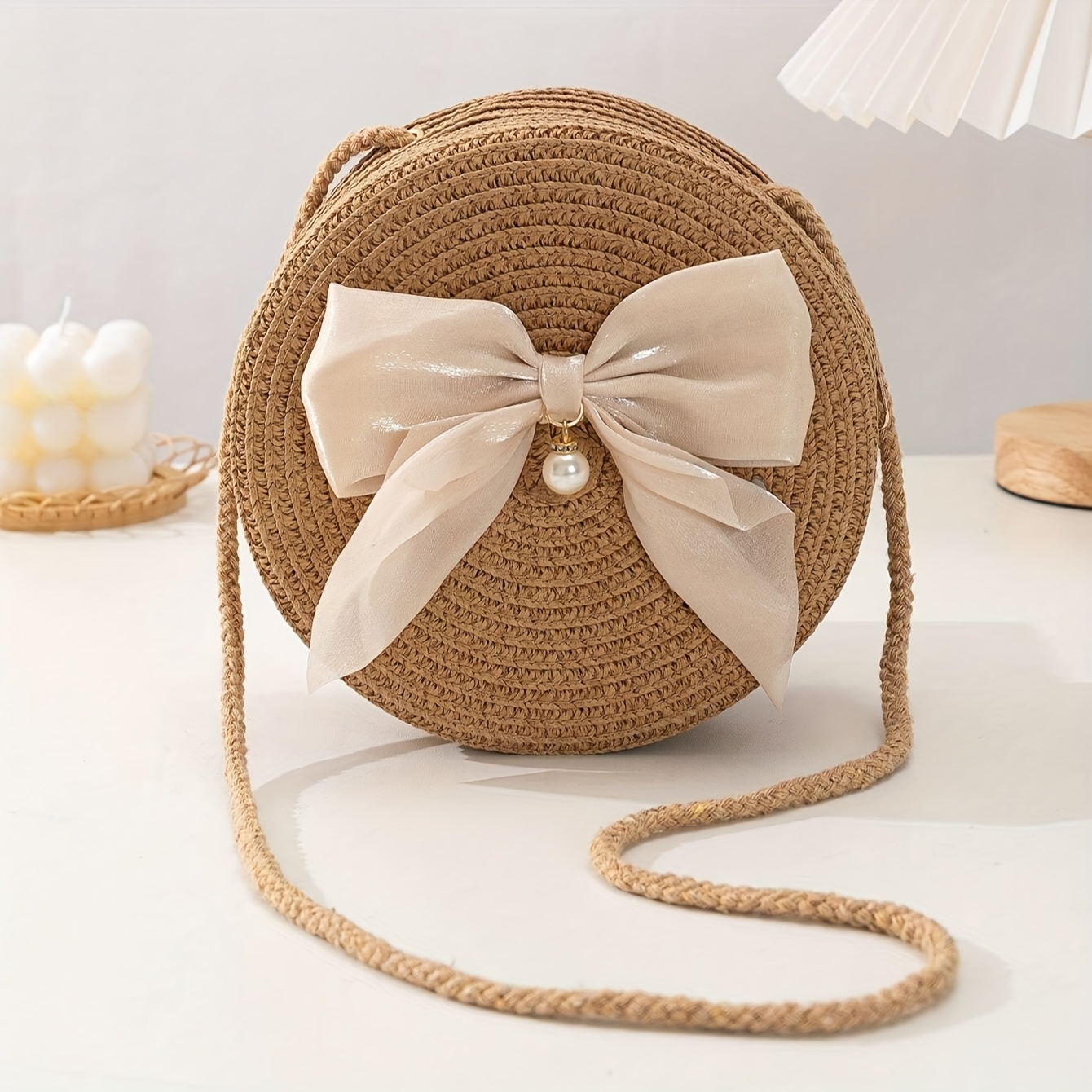 Interior Design Style - Elegancka okrągła torebka crossbody ze słomy